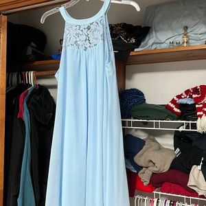 Sleeveless dress that is loose fitting.